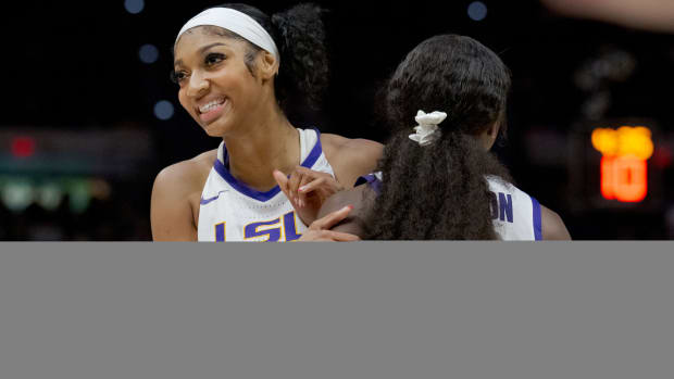LSU Tigers forward Angel Reese and guard Flua, jae Johnson celebrate against the Virginia Tech Hokies.
